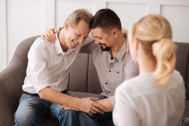 Two men hugging